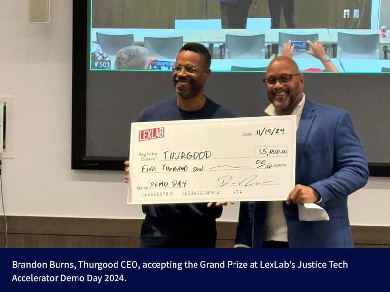 Brandon Burns, Thurgood CEO, accepting the Grand Prize at LexLab's Justice Tech Accelerator Demo Day 2024.
